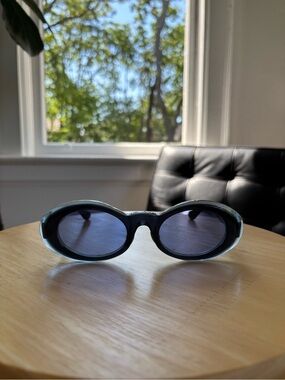 Oval Blue Frame Sunglasses with Dark Lenses